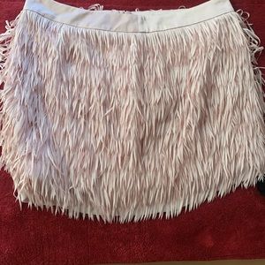 SexyExpress pink fringe mini skirt. side or back zip, hook and eye closure.